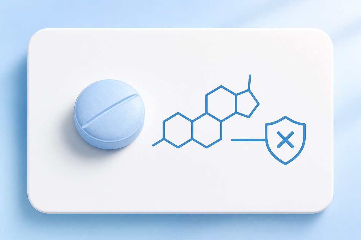 Finasteride tablet beside DHT-block diagram on white rounded card